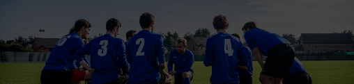 A rugby squad in a huddle